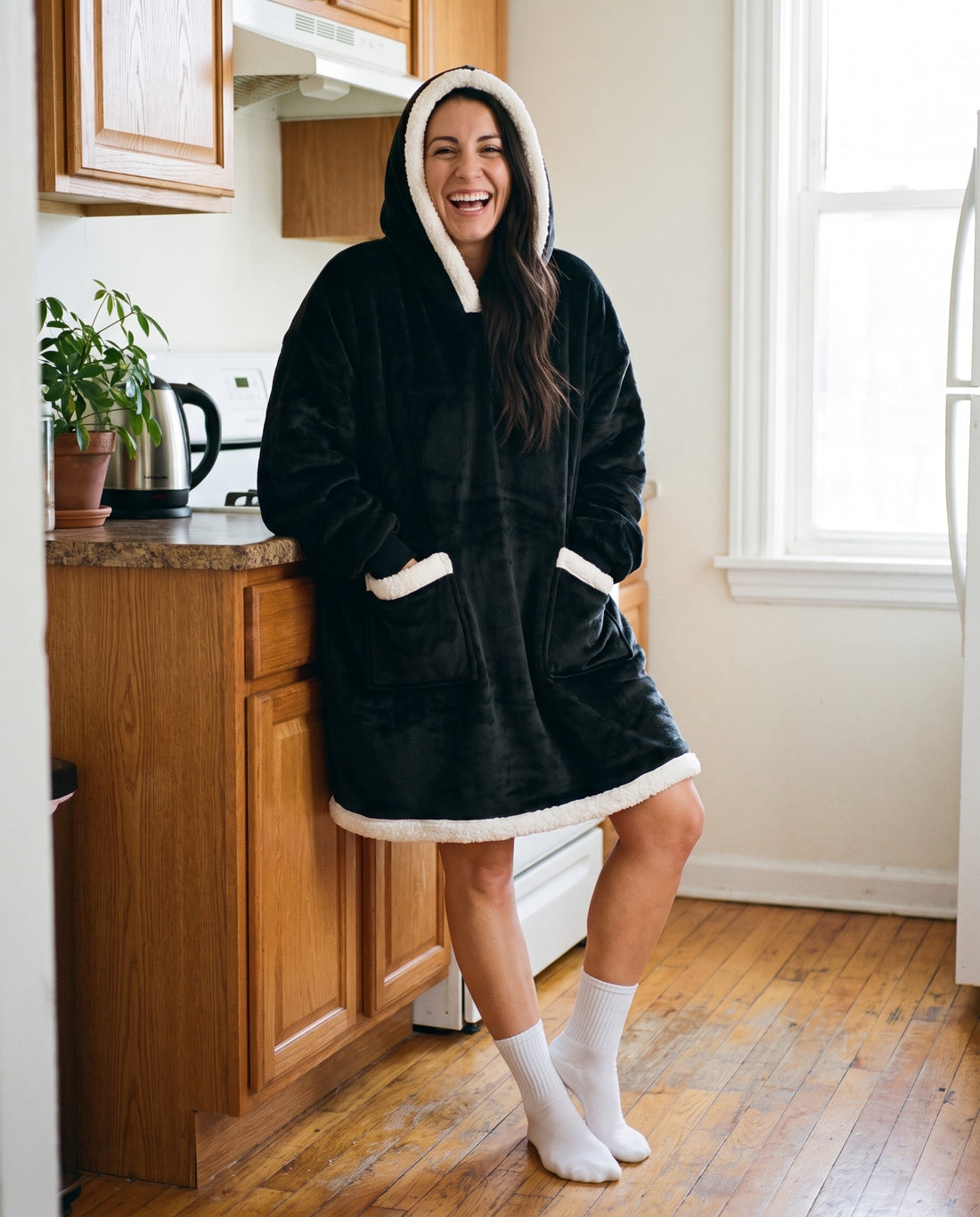 Couchmode Blanket Hoodie in Black, lifestyle