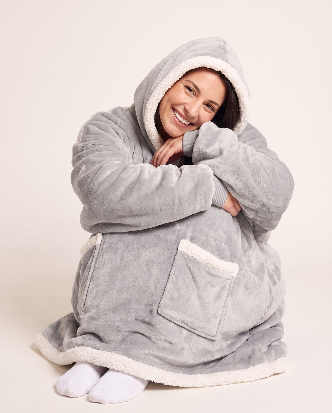 Couchmode Blanket Hoodie in Grey, sitting cozy