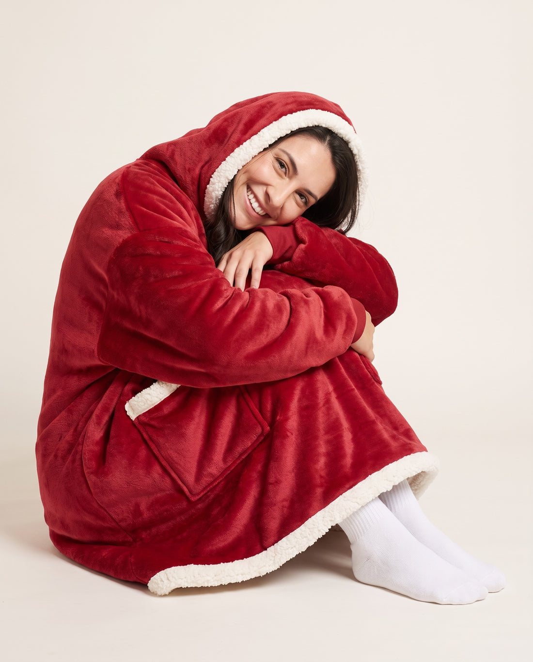 Couchmode Blanket Hoodie in Red, sitting cozy